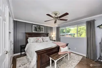 Primary suite w/view, designer wall details, built-ins and ceiling fan.