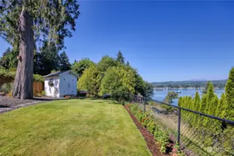 Lower yard with fresh landscaping and garden shed. Amazing and active water views of Ostrich Bay, Dyes Inlet and the Olympic Mountain range.