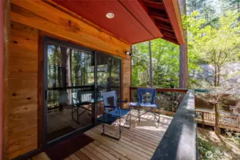 Lovely, covered porch accessed by slider from primary BR