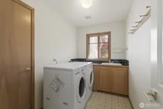 The laundry room on the main floor and 1 of 2 garage entrances are found here. Additionally, there is a mud room off the slate hallway behind the family room that leads to the garage.