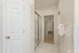 Linen closet, separate toilet room and tiled shower.