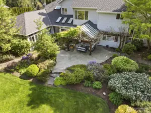 The grounds are a lovely blend of manicured gardens dotted with tall evergreens.
