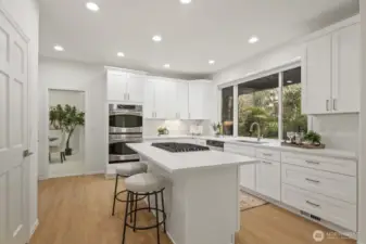 Breakfast bar with seating and walk-in pantry.