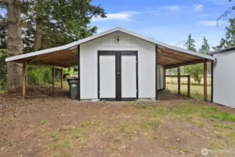 Exterior shed with side covering.
