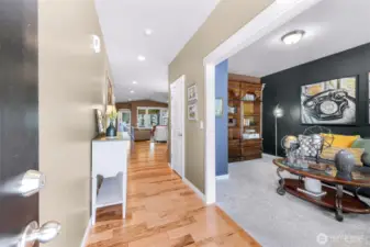 As you enter the home you are welcomed by warm tones and engineered hardwood flooring, an office that could be converted to 3rd bedroom is located just inside the front entry.