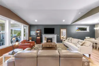 Bright natural light fills this living space while also feel cozy with propane fireplace.