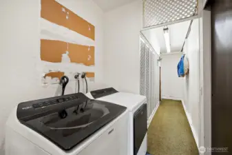 Both sides beyond washer/dryer are oversized storage closets