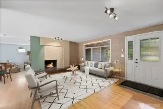 Cozy evenings by the fire in a warm, welcoming living space. Inviting living room with fireplace and open layout.