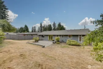 View of home with pavers and French doors.