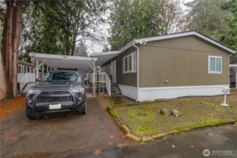 Carport with entry to living room.