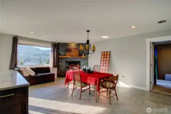 Dining area has wood fireplace.