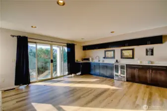 Lower level recreation/game room with wetbar and patio access.