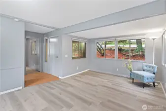 Front entrance opens into the living room with the second bedroom and bathroom nearby.