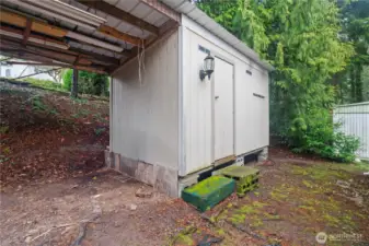 Handy storage shed for tools and extra belongings.