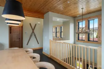 Two-story open area between entry below and dining above