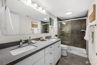 Primary bathroom with quartz countertops and double sinks