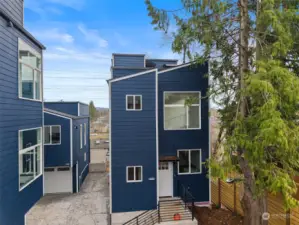 Driveway entrance to #C.  One parking spot on the left.  3 connecting units.  No HOA.