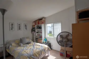 All bedrooms feature vaulted ceilings.