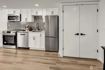 ADU Full size kitchen w/ SS appliance package & front-loading washer & dryer.