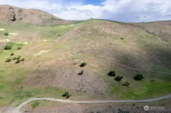 Acreage from high with hillside backdrop