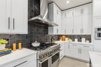 Enjoy hosting in your chef's kitchen equipped with JennAir appliances including 36” built-in refrigerator + 24” built in freezer, 48” dual fuel gas professional range with griddle, wall-mounted hood, built-in microwave oven with speed-cook.