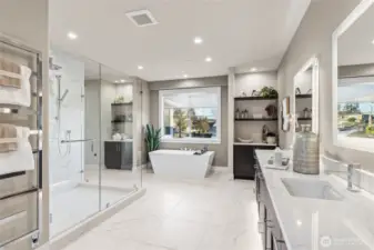 Very spacious primary bathroom with towel warmer and plenty of storage!