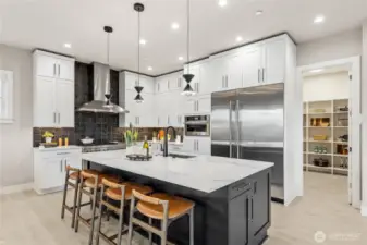 Enjoy hosting in your chef's kitchen equipped with JennAir appliances including 36” built-in refrigerator + 24” built in freezer, 48” dual fuel gas professional range with griddle, wall-mounted hood, built-in microwave oven with speed-cook.