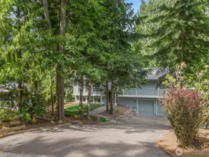 The long wide driveway has enough space to park 4-6 cars.