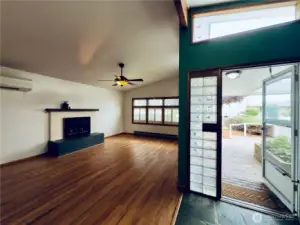 3038 Louisiana St, Longview WA entryway to front covered patio, refinished hardwood floors, living room with a fireplace, shutters, vaulted ceiling, natural light