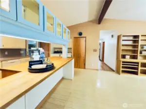 Vaulted ceilings in dining room and kitchen, open, kitchen peninsula , butcher-block counter, all appliances stay, built-in shelving