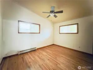 Second bedroom, ceiling fan, vaulted ceiling, hardwood floor, move-in ready
