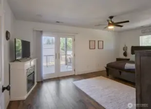 Primary bedroom with covered balcony