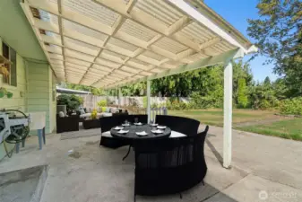 Relax on the spaciously covered porch and take in the serene sounds of nature in your park-like yard. The porch is large enough to accommodate ample seating, potted plants, and all your favorite outdoor décor, creating the ideal space for unwinding or entertaining.