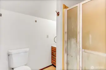 Bath with shower upstairs.