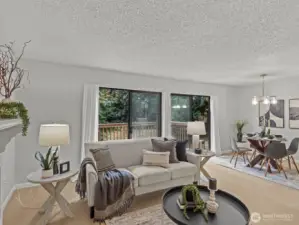 The large living room also has a sliding glass door, providing an abundance of natural light.