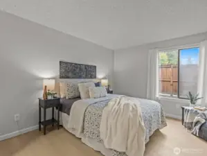 Next door is the primary bedroom.
