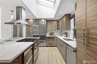 Oversized kitchen island with chef inspired kitchen and professional grade appliances Subzero, Wolf, Thermador. Heated floors in kitchen