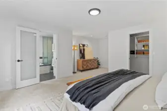 Primary bedroom with 5-piece ensuite bath and large walk-in closet