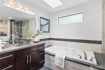 Primary bedroom with 5-piece ensuite bath and large walk-in closet