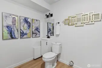 Downstairs half bath / laundry off rec room