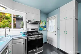 Traditional kitchen has been updated with new appliances and a wonderful corner window.