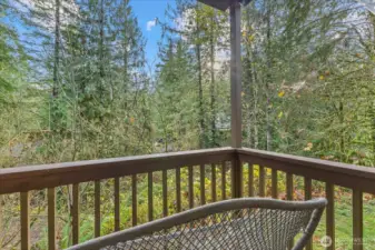 Porch off the back deck is a great spot to take in the fresh air.