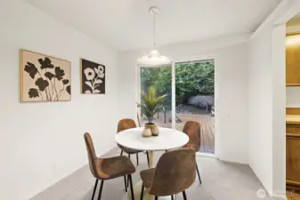 Cozy dining area with slider to newer deck.