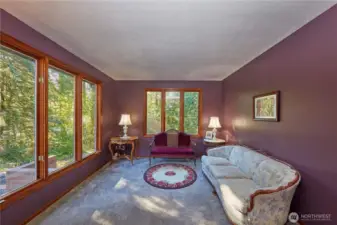 Formal living room. The wood windows bring in so much natural light.