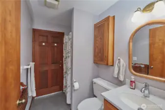 Main floor bathroom. There is a door within the bathroom that leads to the back deck for easy access into home after working outside.