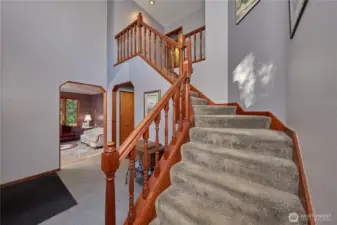Staircase leading to second floor from front entry way.