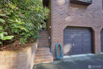 Staircase behind home leading to back deck.