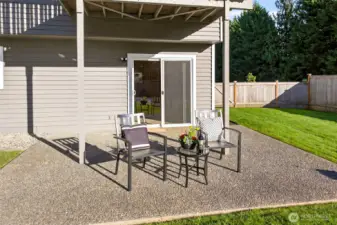 A generous patio spans the lower level, offering a practical extension of the indoor space with direct access from the home. The fenced backyard provides privacy, room to spread out, and a comfortable place to host, relax, and enjoy the quiet English Hill setting.