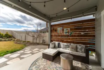 Covered patio with direct access from sliding glass door.