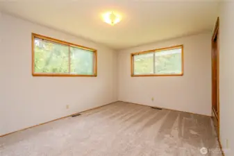 Extra large Bedroom #3 enjoys back and side yard views and built-in cedar closet & drawers.